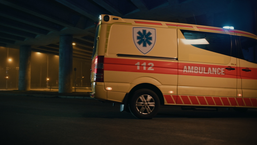 Team of EMS Paramedics Quickly Jump Out from Ambulance Vehicle. Female Doctor Brings First Aid Kit. Emergency Care Assistants Arrived on the Scene of a Traffic Accident on a Street at Night. Royalty-Free Stock Footage #1060901089