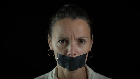 Restrictions on freedom of speech. Woman with a sealed mouth.