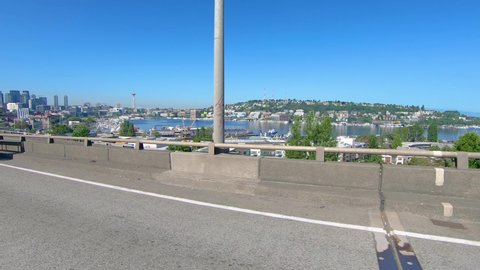 Seattle , Washington / United States - 08 15 2019: POV Driving on West Seattle Bridge past an on ramp and ramp meter