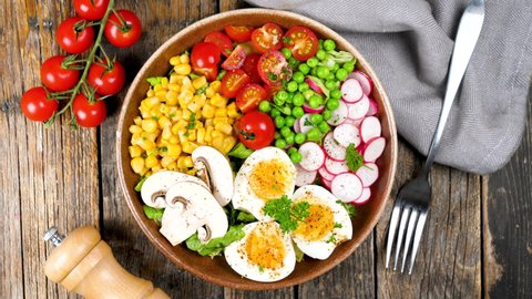 buddha bowl- vegetable salad with egeg, mushroom,tomato,pea and radish
