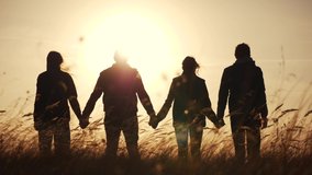 teamwork. team community hold hands together silhouette at sunset unity. group of people hands. teamwork workers carry out put your hands up . team in the company working partnership business - Powered by Shutterstock - Get 15% off with code: PIKWIZARD15