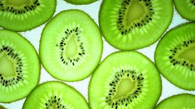 Top view Rotate of Slice of kiwi fruit  on white background, Close up fresh kiwi sliced on white background and slowly rotating.