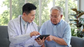 Asian man professional doctor showing medical test result explaining prescription using digital tablet app visiting senior man patient at home sitting on sofa. Elderly people healthcare tech concept. - Powered by Shutterstock - Get 15% off with code: PIKWIZARD15