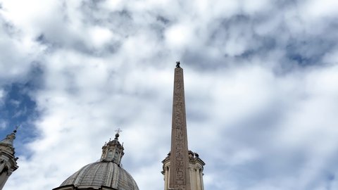 1and the façade of the church of Sant Agnese in Piazza Navona in Rome on a cloudy day. Baroque art in Rome