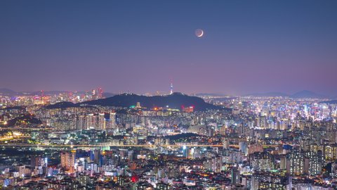 Zoom in Time lapse Day to night Landscape of Seoul City South Korea And the moon
