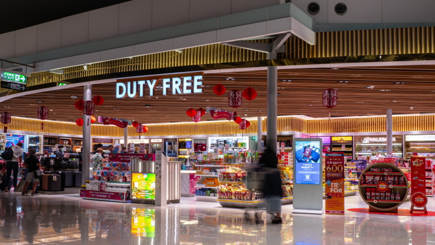 BANGKOK, THAILAND - FEBRUARY 3 2020: city national airport duty free store crowded timelapse panorama 4k circa february 3 2020 bangkok, thailand.
