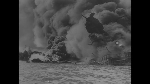 CIRCA 1941 - US Navy ships go up in flames after the attack on Pearl Harbor, spurring patriotism across the country (narrated in 1963).