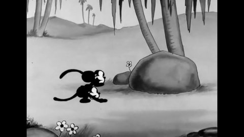 CIRCA 1930 - In this animated film, Bosko gets in trouble with a baby gorilla's mom for spanking it when it was rude to him.