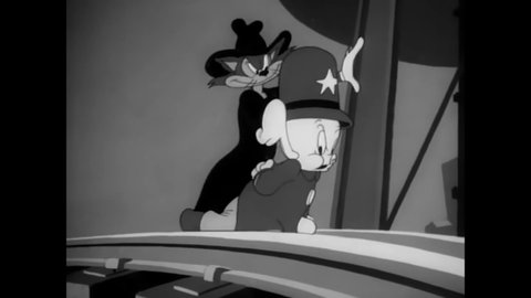CIRCA 1943 - In this animated film, policeman Porky Pig and his bloodhound blow up a Nazi spy with his own time bomb.