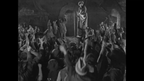 CIRCA 1923 - In this adaptation of the Hunchback of Notre Dame, Clopin and his men prepare the gallows to hang Gringoire, an aristocratic spy.
