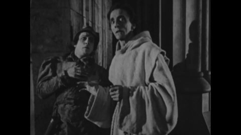CIRCA 1923 - In this silent movie adaptation of the Hunchback of Notre Dame, Quasimodo rings a bell as he dies.