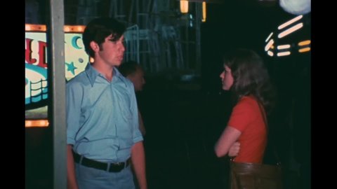 CIRCA 1976 - In this horror film, a couple breaks up at a carnival which is then attacked by a giant monster.