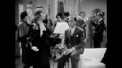 CIRCA 1936 - In this comedy movie, an heiress (Carole Lombard) announces her engagement at a party to a surprised man.