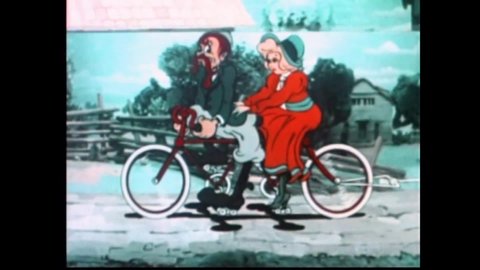 CIRCA 1935 - In this animated film, an Edwardian couple rides a bicycle built for two, towing their children along.
