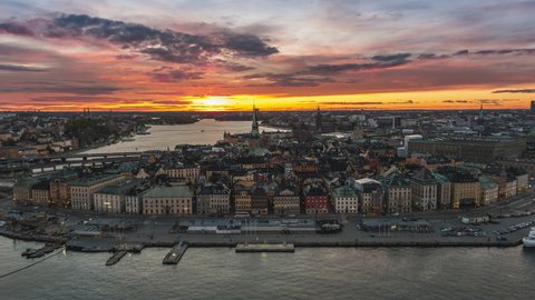 Establishing Aerial View Shot of Stockholm, Gamla Stan, super sunset, all colors on the sky, Sweden