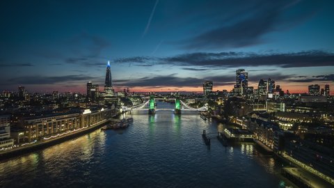 Distinguished Tower Bridge, Establishing Aerial View Shot of London Skyline, London UK, United Kingdom at night evening