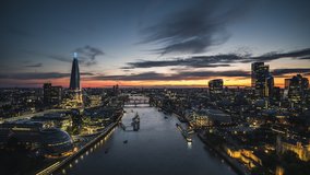 Revealing Shot, Impressive Royal Skyline,The City & Tower Bridge, Colorful Sunset, Establishing Aerial View Shot of London UK, United Kingdom