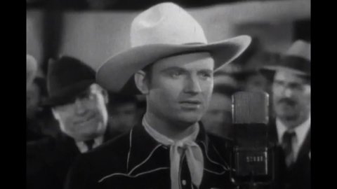 CIRCA 1937 - In this western film, a singing deputy (Gene Autry) dedicates the song "Old Buck-A-Roo" to his sheriff.
