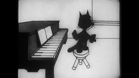 CIRCA 1930 - In this animated film, Felix the Cat sees grasshoppers playing leap frog and has them play the piano for him.
