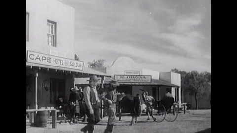 CIRCA 1937 - In this western film, a town and saloon are overrun with horses which must be returned to their corral.