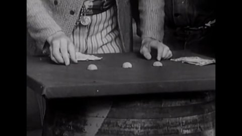 CIRCA 1937 - In this western film, a con man gets in trouble for running a shell game outside a saloon.