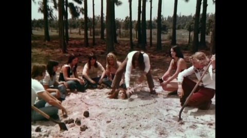 CIRCA 1975 - In this horror film, Satanists bury a woman in sand up to her head, which is covered in liquid to attract fire ants.