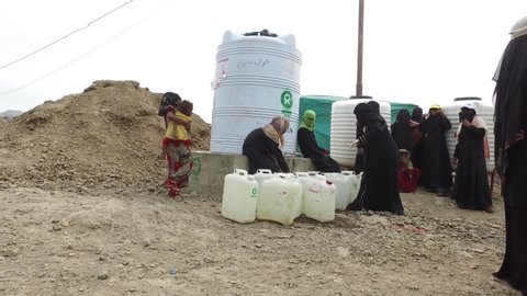 Taiz / Yemen - 09 Feb 2017: Children fetch water due to the water crisis and the difficult living conditions witnessed by residents of the Taiz city in southern Yemen since the beginning of the war