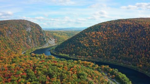 Aerial view of Delaware Water Gap on a sunny autumn day with forward camera motion. The Delaware Water Gap is a water gap on the border of the U.S. states of New Jersey and Pennsylvania - part 1