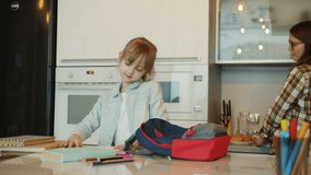 Pregnant young mother is giving lunch box to cute daughter saying good-bye waving hand smiling before school. Childcare and motherhood concept. - Powered by Shutterstock - Get 15% off with code: PIKWIZARD15