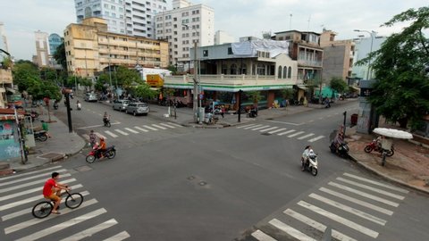 Crossroad in Ho Chi Minh City, Vietnam. Busy traffic. Timelapse.