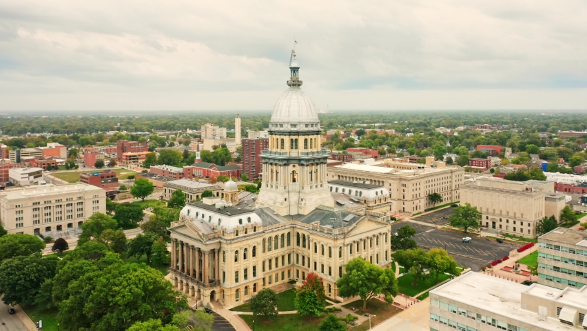 Drone rotation around Illinois State Capitol. The Illinois State Capitol, in Springfield, Illinois, houses the legislative and executive branches of the government of the U.S. state of Illinois Royalty-Free Stock Footage #1060948801