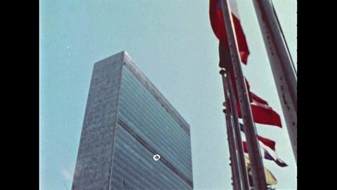 CIRCA 1967 - Bustling city life is seen outside the United Nations building in New York City, New York.