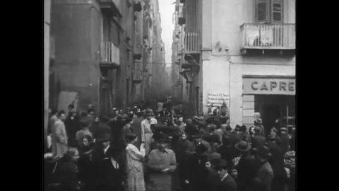 CIRCA 1940s - Italians and refugees undergo daily activities in overcrowded Naples after the allied occupation in the 1940s.