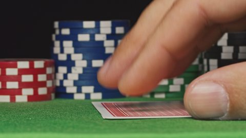 Poker player shows his pair hand two kings