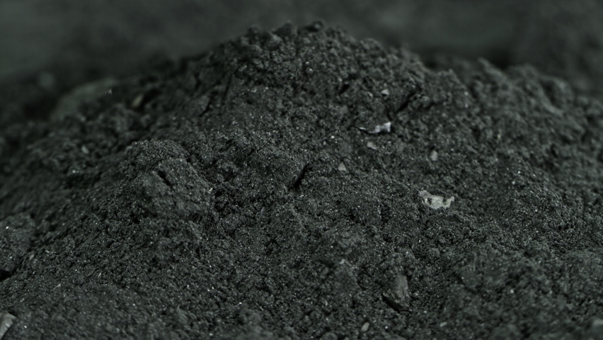 Super Slow Motion Shot of Coal Falling into Black Powder at 1000 fps. Royalty-Free Stock Footage #1060960117