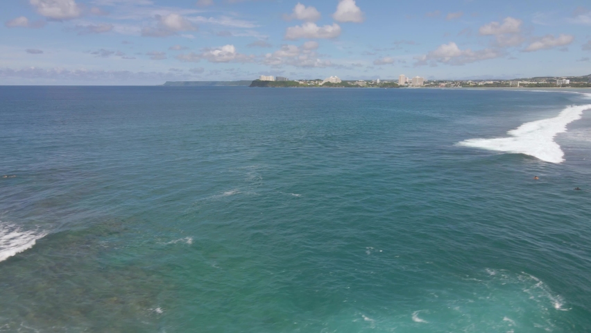Drone shot panning up over Agana Bay to view Tamuning Guam