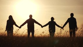 teamwork. team community hold hands together silhouette at sunset unity. group of business people hands. teamwork a workers carry out one mission go the goal. team in the company working partnership - Powered by Shutterstock - Get 15% off with code: PIKWIZARD15