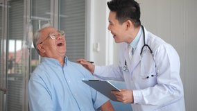 Asian man doctor give help support handicapped old patient happy sitting in wheelchair, doctor caregiver or nurse assist take care of smiling senior disabled grandfather, elderly healthcare concept. - Powered by Shutterstock - Get 15% off with code: PIKWIZARD15