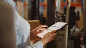 In Warehouse Manager Uses Digital Tablet with App to Check Package Delivery Status with Graphs, Infographics, and Statistics on Screen. Distribution Center with Shelves with Cardboard Boxes - Powered by Shutterstock - Get 15% off with code: PIKWIZARD15