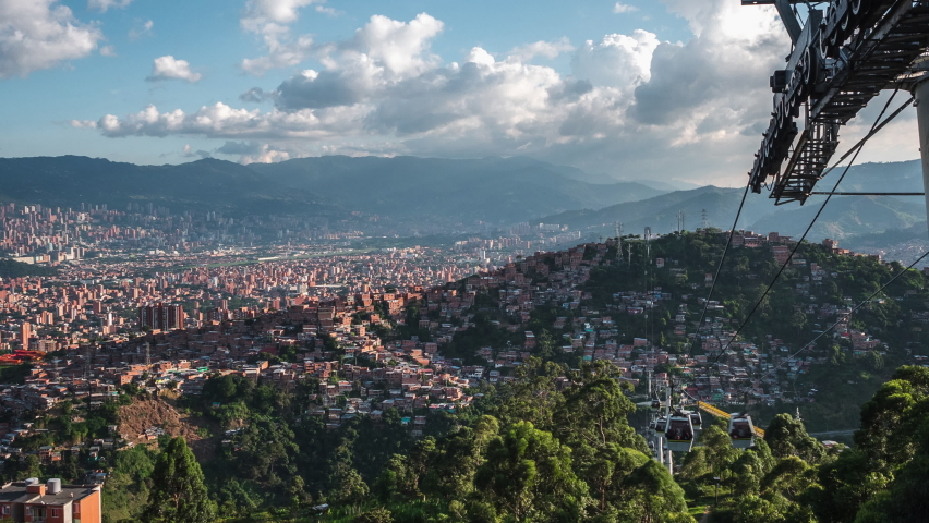 Zoom out time lapse view of metro cable car public transit system in Medellin, Antioquia Department, Colombia.