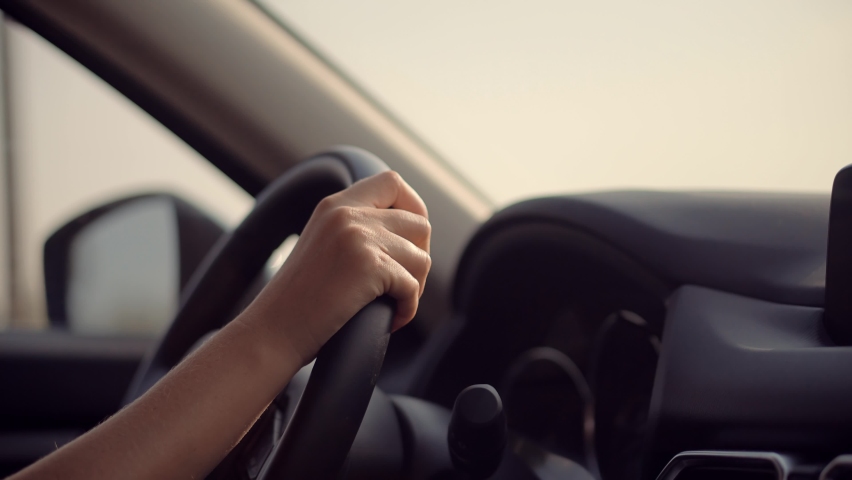 Woman Driver Driving Car Steering Wheels Commuting.Travelling Vacation Road Trip Adventure SUV Transportation.Transport Driver Turning Steering Wheel Car.Driver Travel Driving Auto Car Wheels Commuter Royalty-Free Stock Footage #1060990795