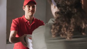 home delivery - courier delivers pizzas to a young woman - Powered by Shutterstock - Get 15% off with code: PIKWIZARD15