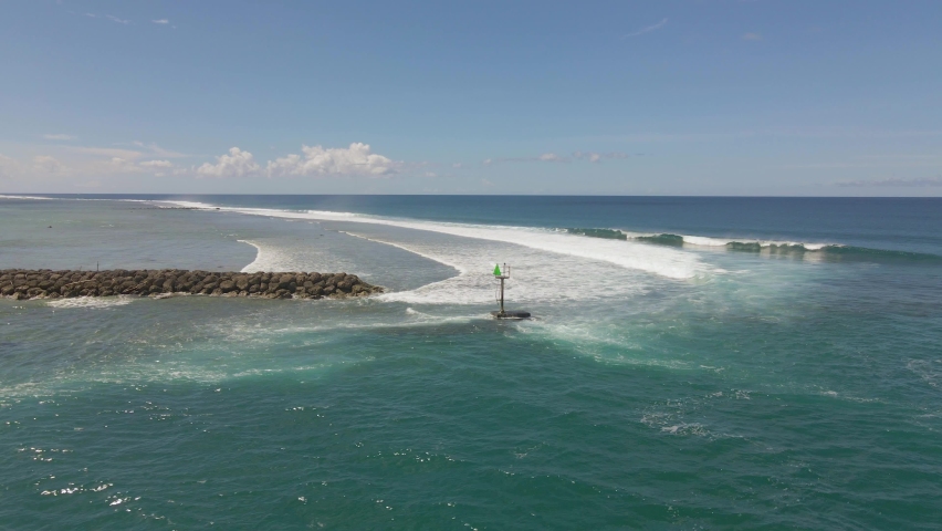 Fast moving drone shot of the Jetty outside Hagatna Boat Basin Guam