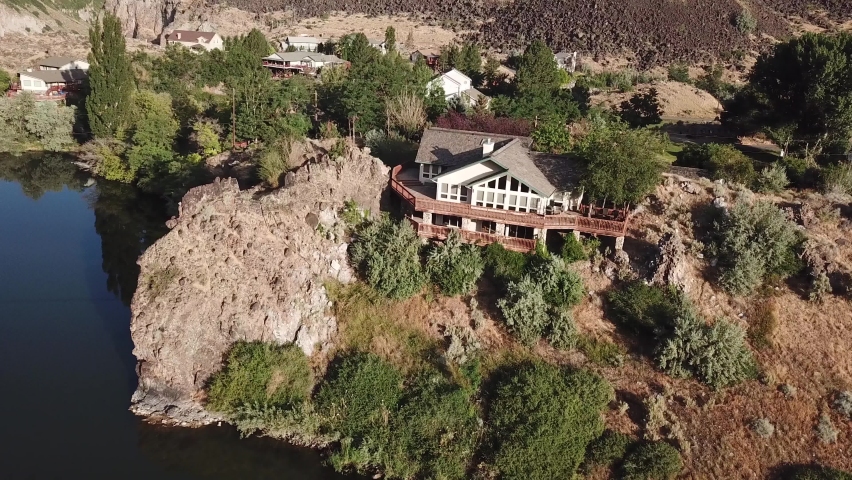 House on Rocky Hill Over Snake River, Upstream of Shoshone Falls. Aerial View on Sunny Summer Day