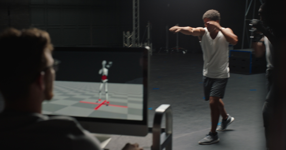 actor wearing motion capture suit rehearsing martial arts with instructor teaching fighting moves mo-cap suit for 3d character animation for virtual reality technology