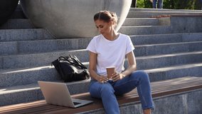 Businesswoman sitting stairs summer park using laptop Business person working remote. Outdoor Successful european caucasian woman freelancer make video call teacher study work online lessons 