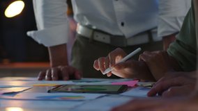 Group of Asia young creative people in smart casual wear discussing business brainstorming meeting ideas mobile application software design in night office. Closeup or close-up of coworker concept. - Powered by Shutterstock - Get 15% off with code: PIKWIZARD15