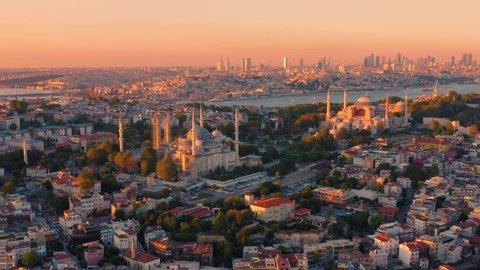 Istanbul, Turkey. Sultanahmet with the Blue Mosque and the Hagia Sophia (Ayasofya) with a Golden Horn on the background at sunset. Aerial view
