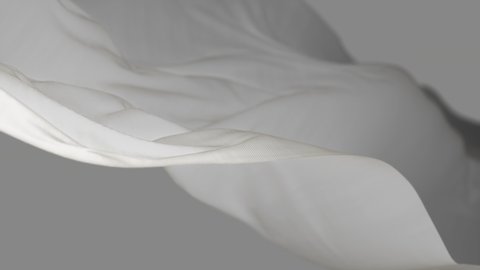 4k White wave satin fabric loop background.Wavy silk cloth fluttering in the wind.tenderness and airiness.3D digital animation of seamless flag waving ribbon streamer riband. 