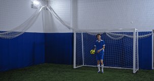 Portrait of asian professional football player, korean man after soccer training, serious athlete, indoor stadium field, professional arena, motivational video. Creative Teenagers hobbies.